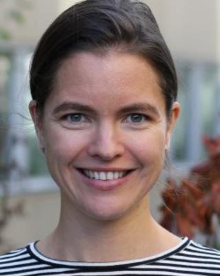 A professional headshot of Amanda
